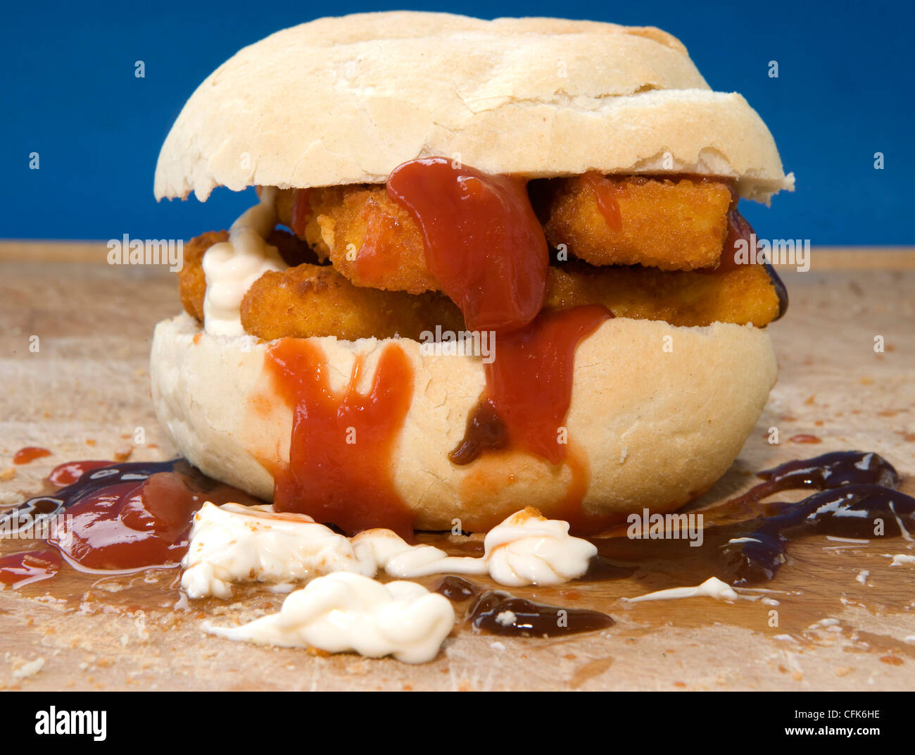 Fish fingers in a roll with ketchup and mayonnaise Stock Photo