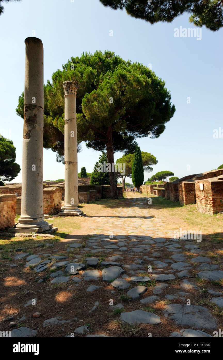 Ostia Antica. Lazio. Italy. View along the lower section of the basalt stone paved Decumano Massimo or Decumanus Maximus with Stock Photo