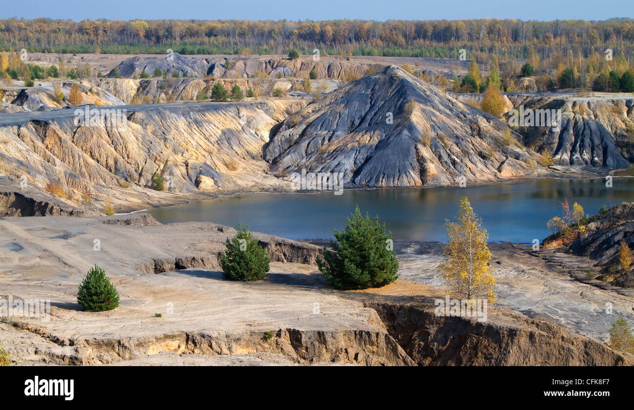autumn landscape with forest and sand hills around the lake Stock Photo