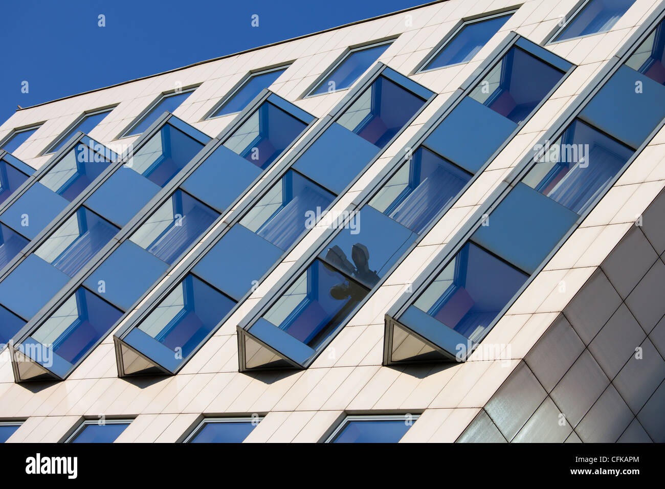 Abstract contemporary shape of an original office building facade Stock