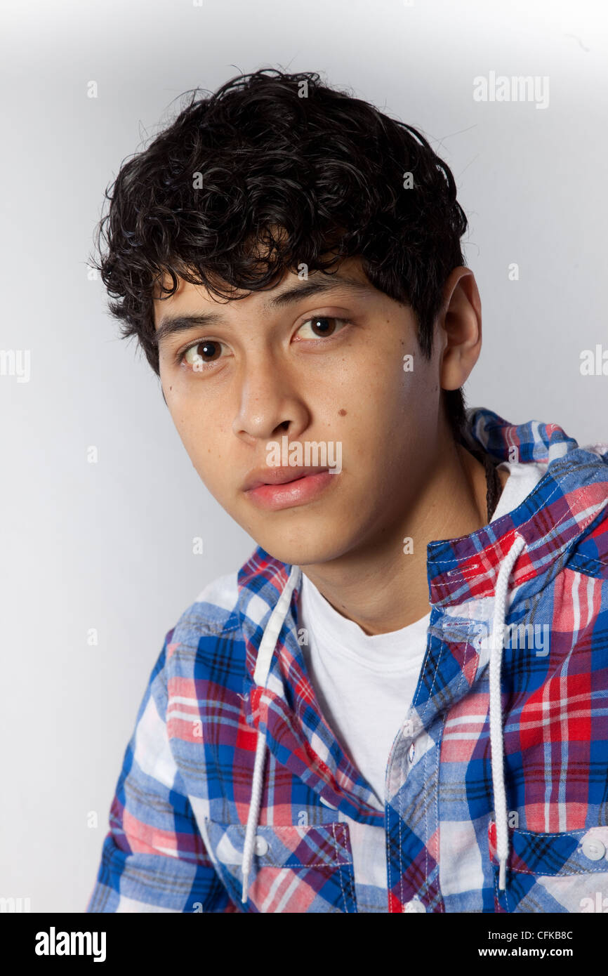 Handsome Young Hispanic Teenager Wearing Red White And Blue Plaid handsome-young-hispanic-teenager-wearing-red-white-and-blue-plaid