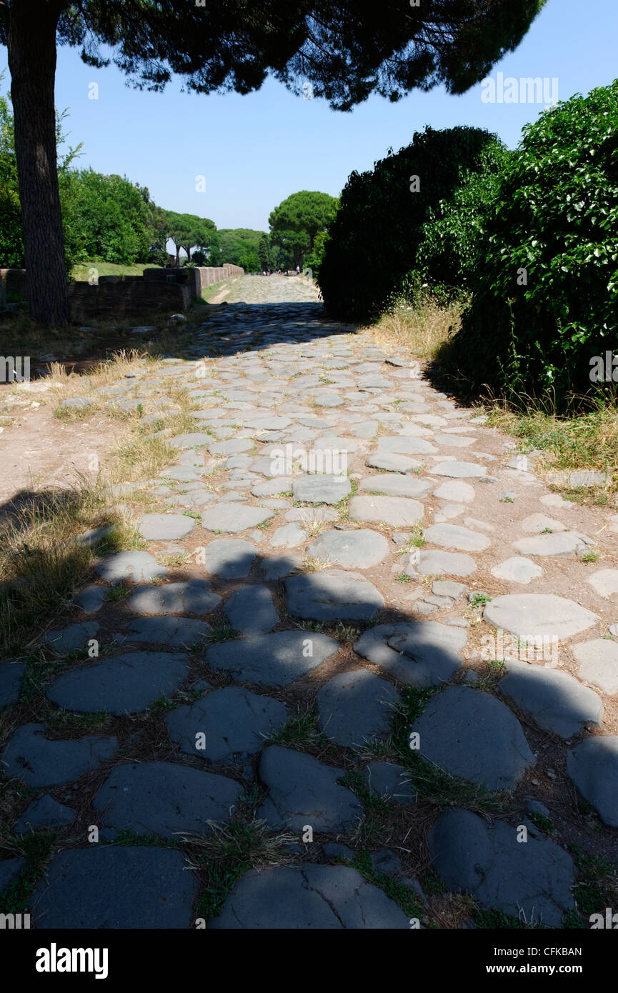 Ostia Antica. Lazio. Italy. View along the upper Decumano Massimo or Decumanus Maximus paved with ancient basalt stone. It is Stock Photo