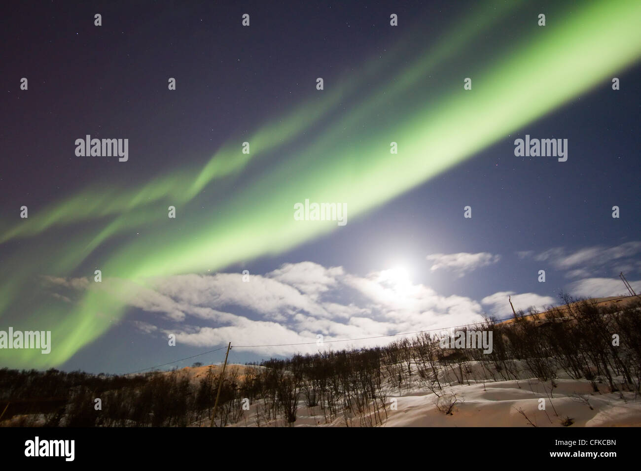 Aurora borealis or northern lights moving across night sky within the Arctic Circle Tromso Troms norway 2012 Stock Photo