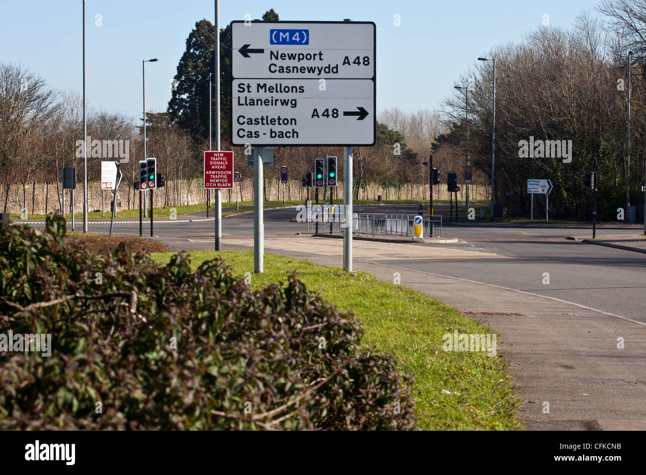 bi-lingual road directional sign at road junction. Stock Photo