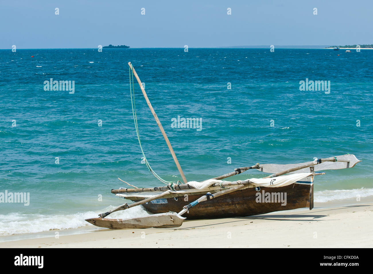 A 'Ngalawa' a traditional double-outrigger canoe on the beach in Stone Town Zanzibar Tanzania Stock Photo