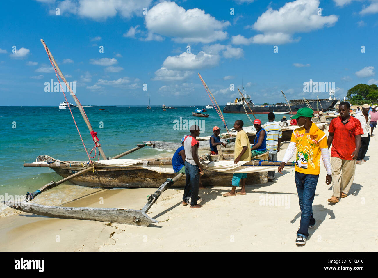 Fishermen prepare their 'Ngalawa' the traditional double-outrigger boats for a regatta in Stone Town Zanzibar Tanzania Stock Photo