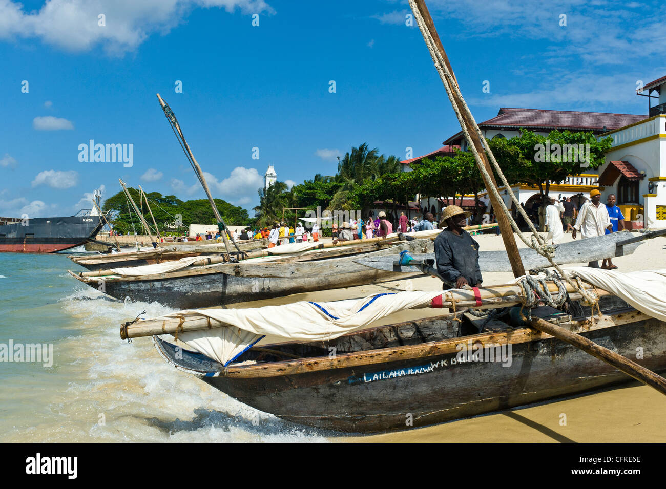 Fishermen prepare their 'Ngalawa' the traditional double-outrigger boats for a regatta in Stone Town Zanzibar Tanzania Stock Photo