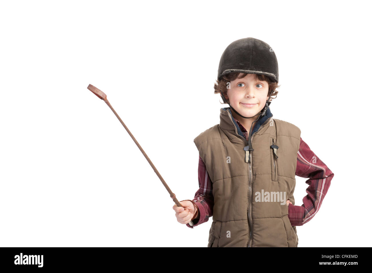 boy with horse ourfit and whip , isolated on white background Stock Photo