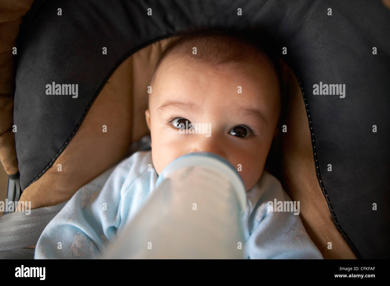 Baby in Car Seat having a Bottle Stock Photo Alamy