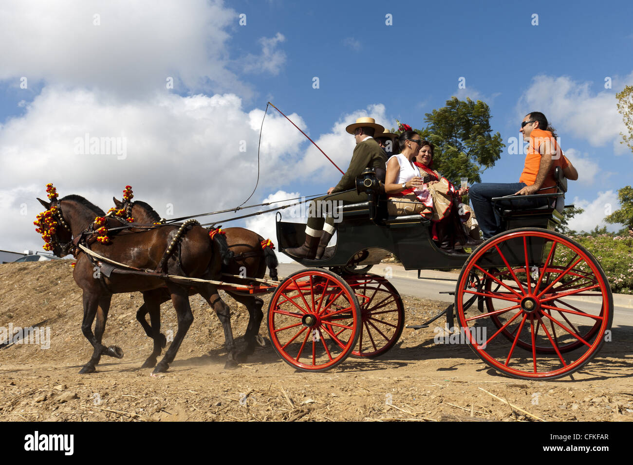 Two Horse carriage with passengers enjoying a day out,  La Cala de Mijas, Andalucia. Spain Stock Photo