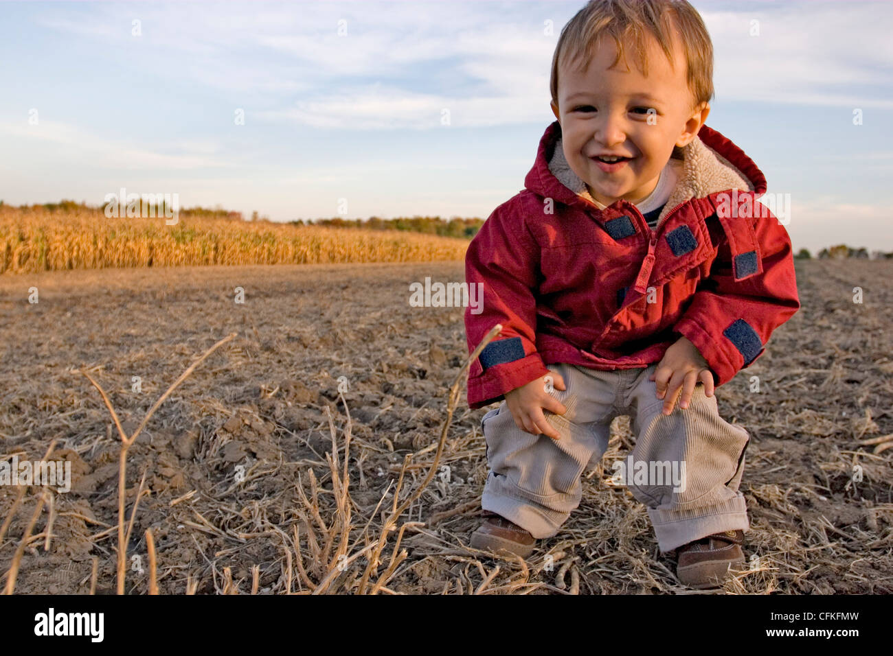 Young Boy Standing in Field Stock Photo - Alamy