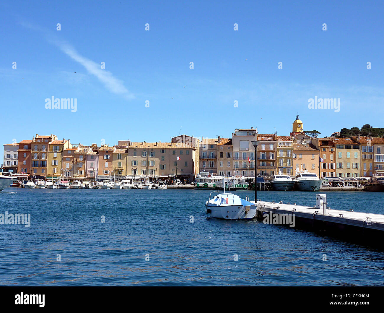 Saint-Tropez's harbor, bell tower and colored buildings by beautiful ...