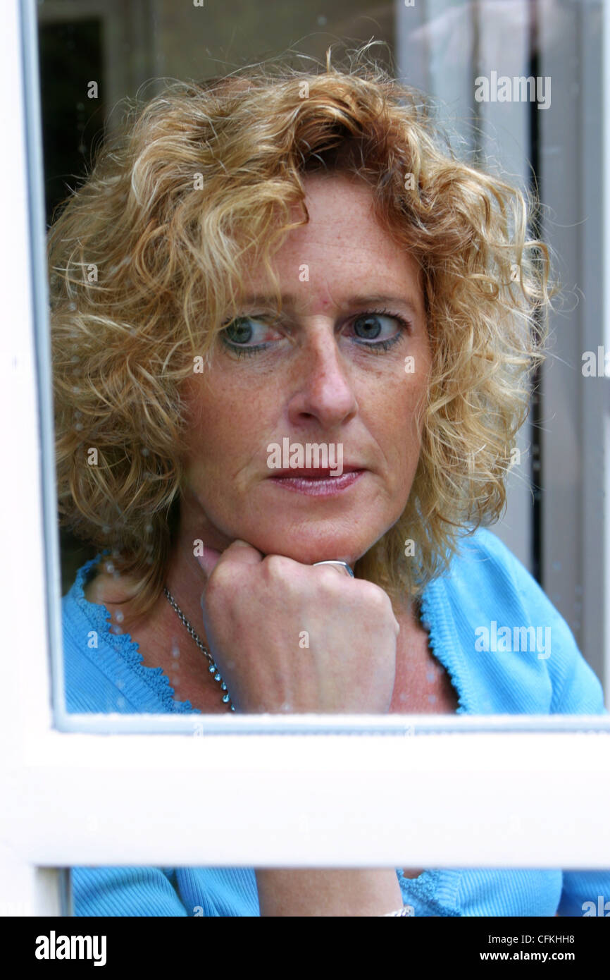 Blond mature woman thinking hi-res stock photography and images - Alamy