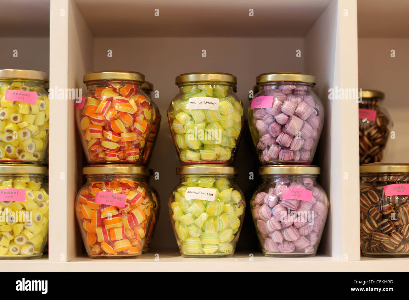 Jars of multicoloured sweets on sale in a sweet shop in Bruges Stock