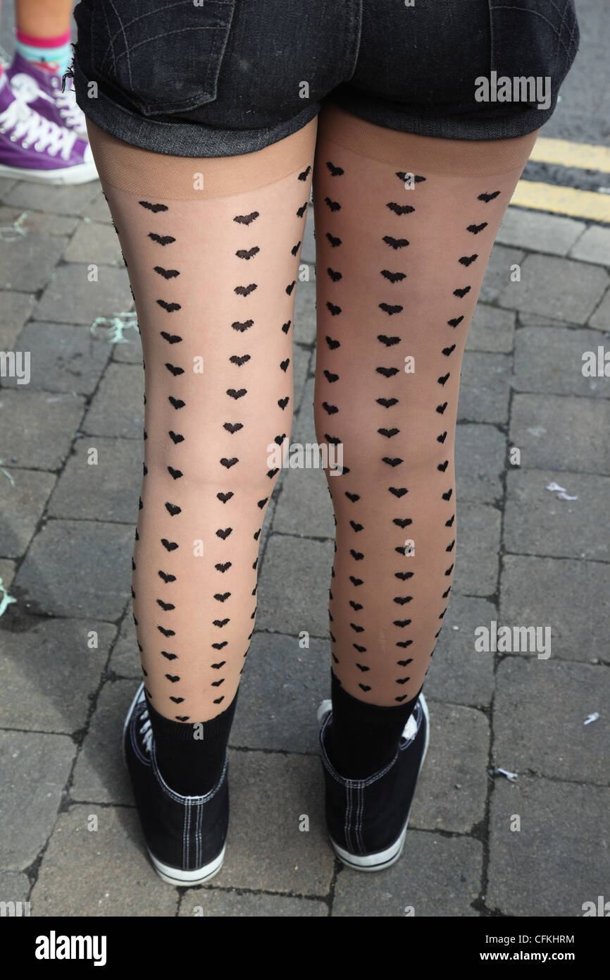 back view of young woman wearing patterned tights Stock Photo