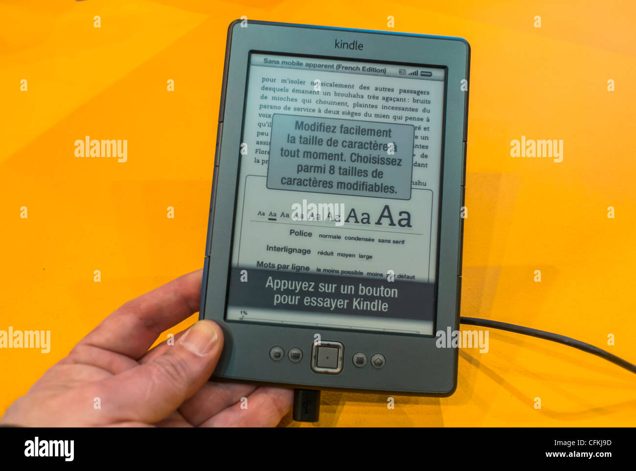 Paris, France, Close up, Hand Holding Electronic Book, Tablet, "Kindle" at  Salon du Livre, Book Fair, Amazon Books Stall Stock Photo - Alamy