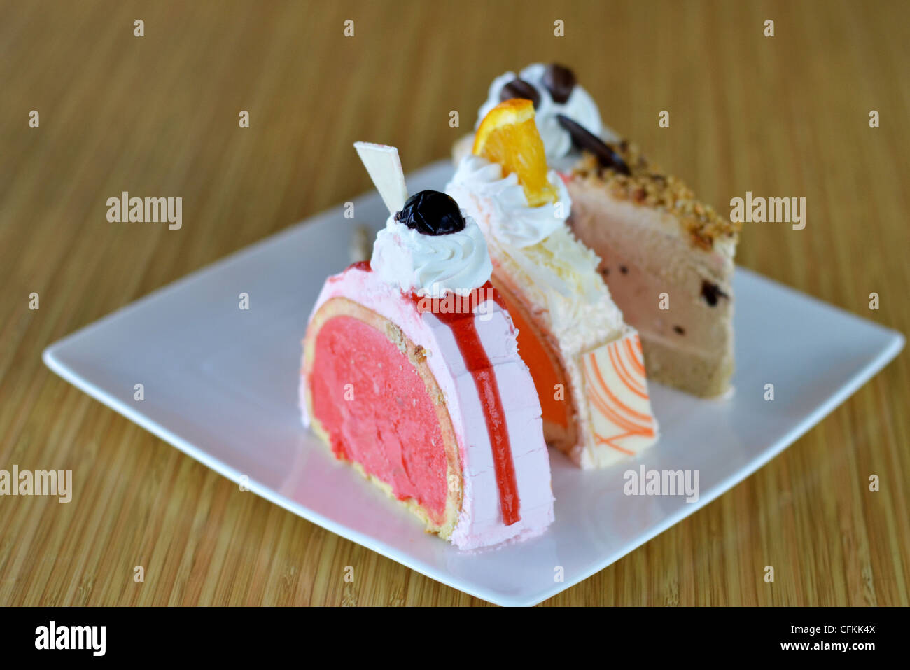 three of ice cream cake ,orange strawberry and chocolate Stock Photo