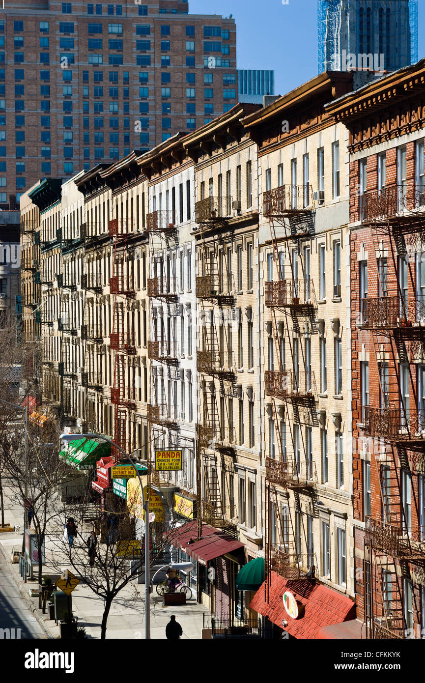 Fire escapes on tenement apartment buildings along upper Broadway in Harlem neighborhood, New York City. Stock Photo