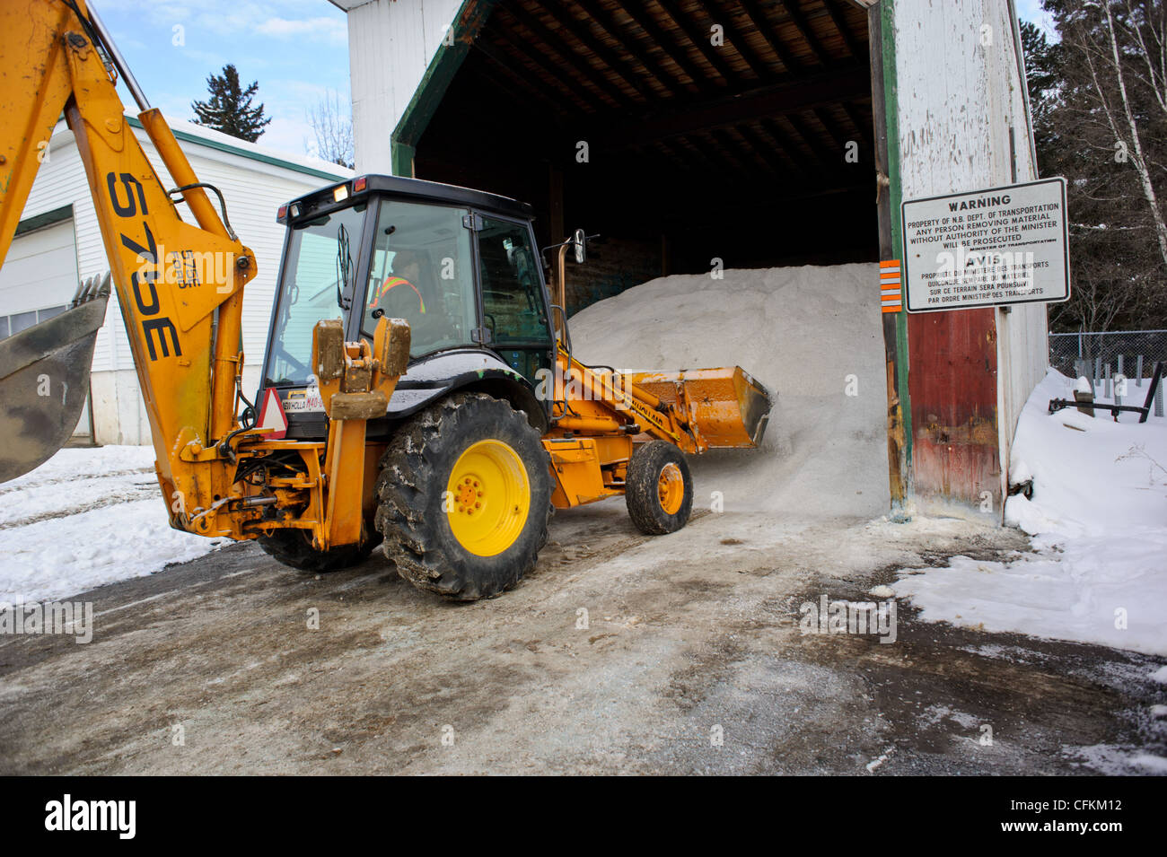 Front end loader loading road salt for deicing winter roads in Canada Stock Photo Alamy