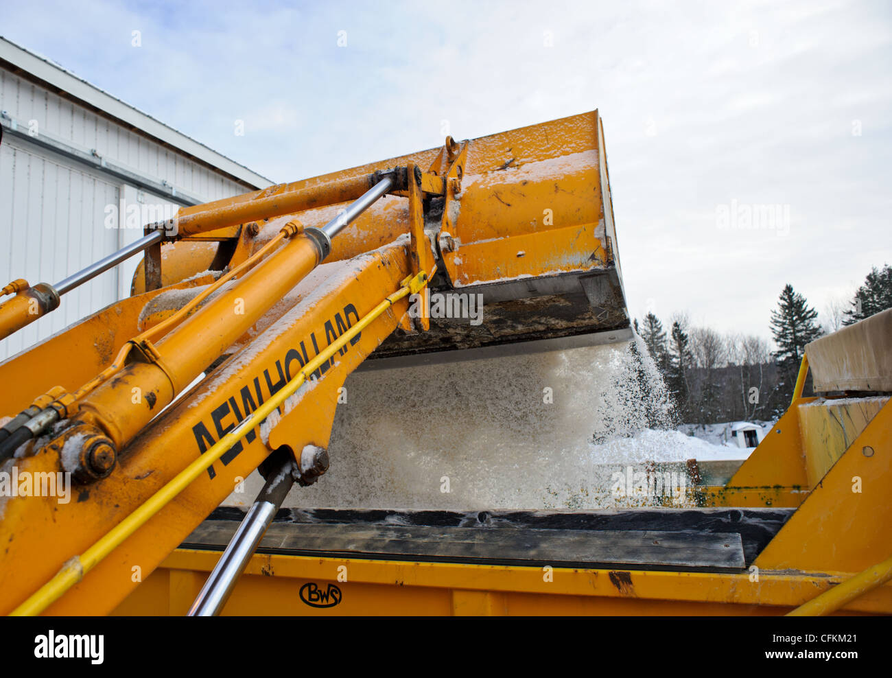 Front end loader loading road salt for deicing winter roads in Canada Stock Photo Alamy