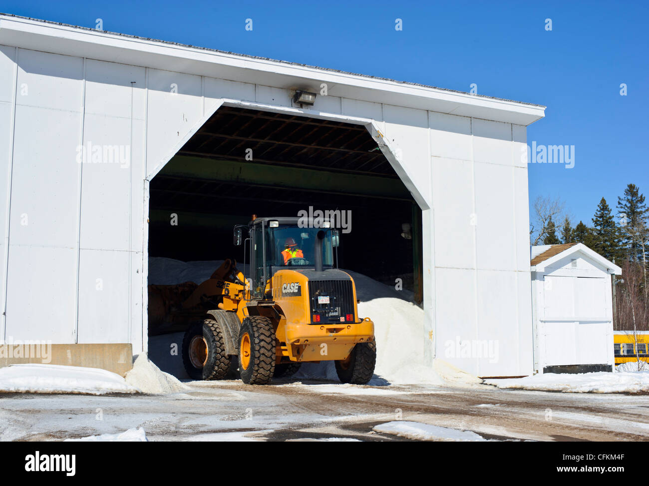 Front end loader loading road salt for deicing winter roads in Canada Stock Photo Alamy