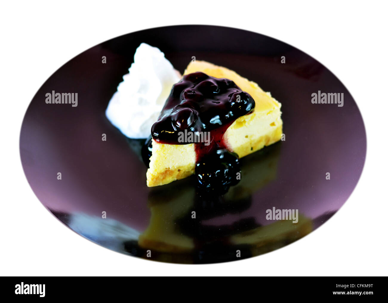 a slice of blueberry cheese cake served with whipped cream Stock Photo