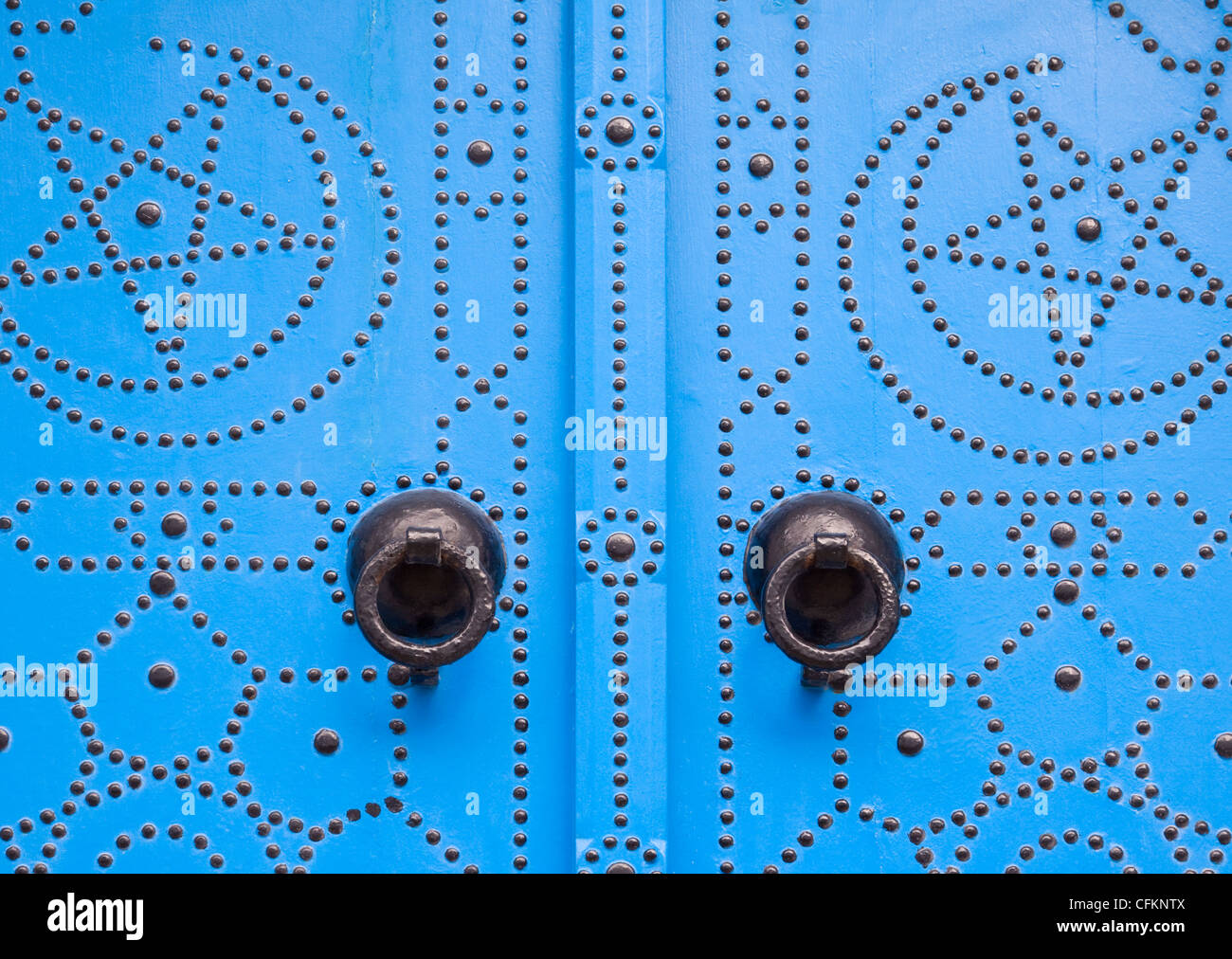 Detail of blue door and door knockers, Tunisia Stock Photo