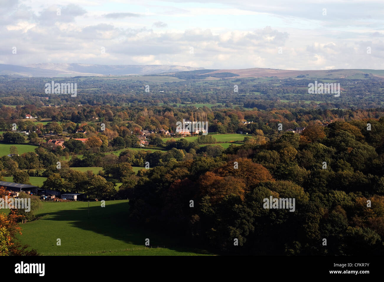 A view across The Cheshire Plain from Alderley Edge toward Kinder Scout and the Pennine Moors  Autumn Cheshire England Stock Photo