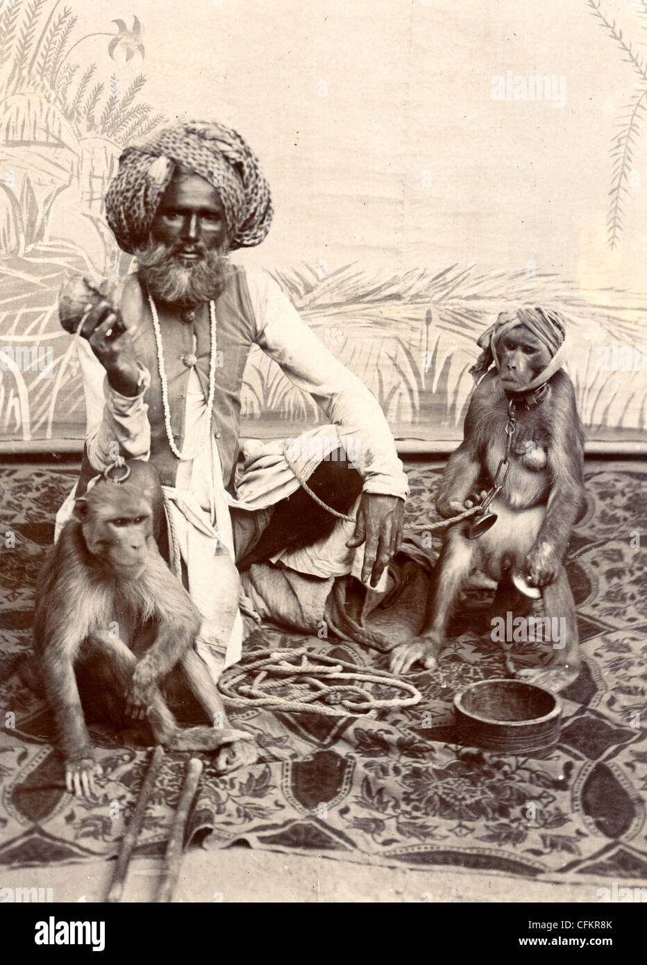 Indian Fakir & Pair of Trained Chimps Stock Photo