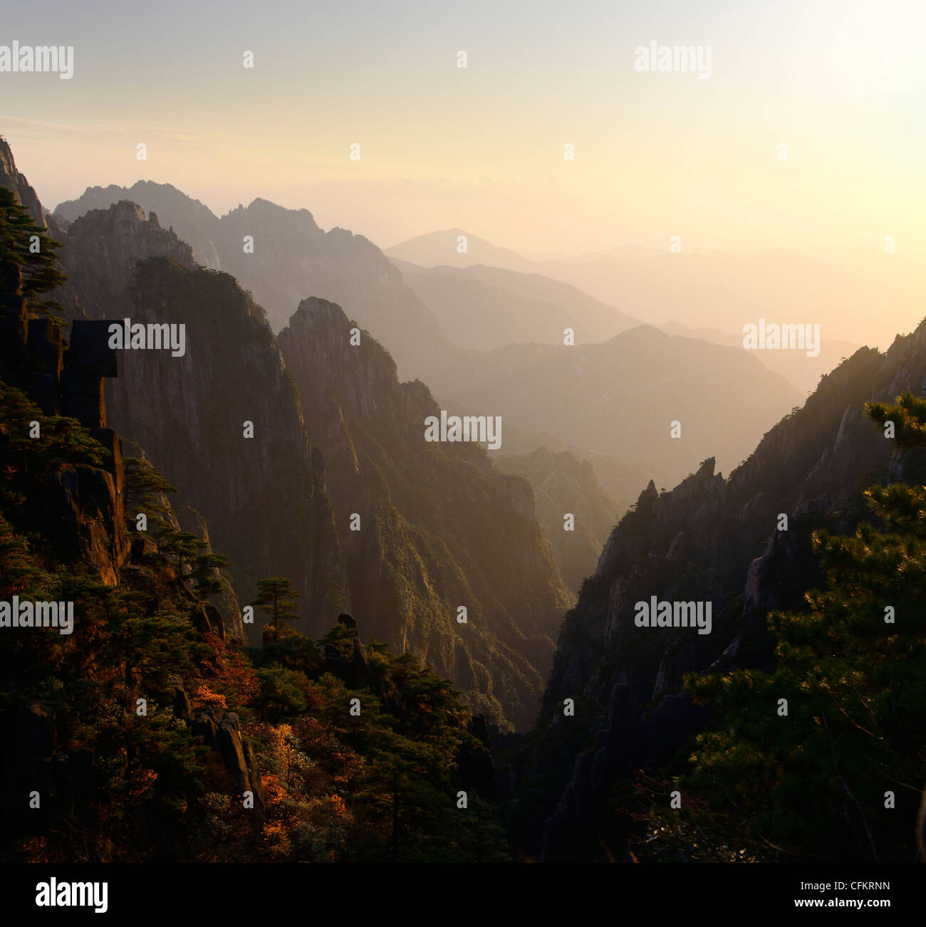 Golden light on West Sea Group Peaks From Cloud Dispelling Pavilion on Huangshan Yellow Mountain Peoples Republic of China Stock Photo
