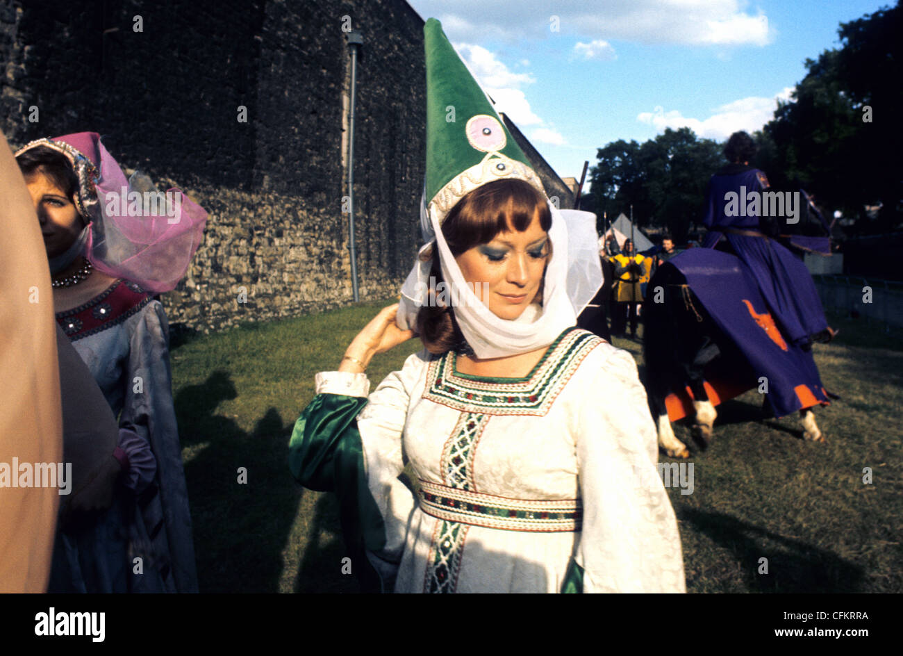 A fair Maiden  in period costume at a Jousting event at The Tower of London UK Stock Photo