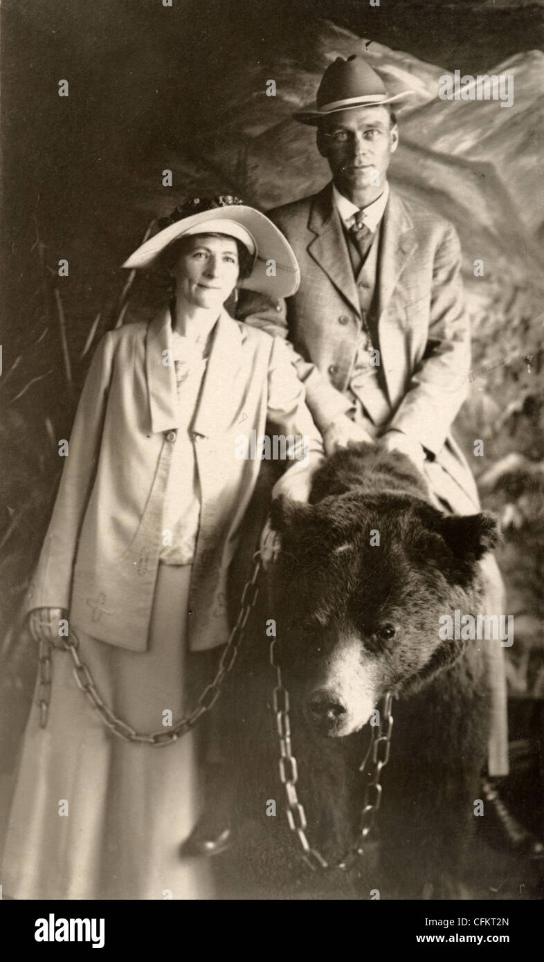 Couple with Husband Astride a Bear Stock Photo