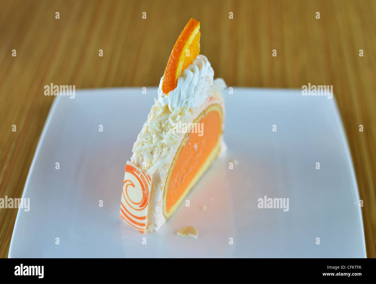 orange ice cream cake with whipped cream Stock Photo