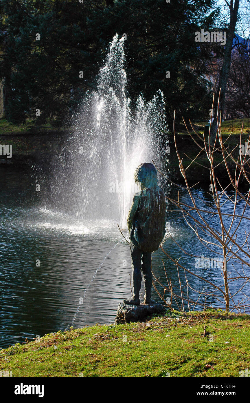 Sculpture of peeing boy in public park of Kristiansund, Norway Stock Photo