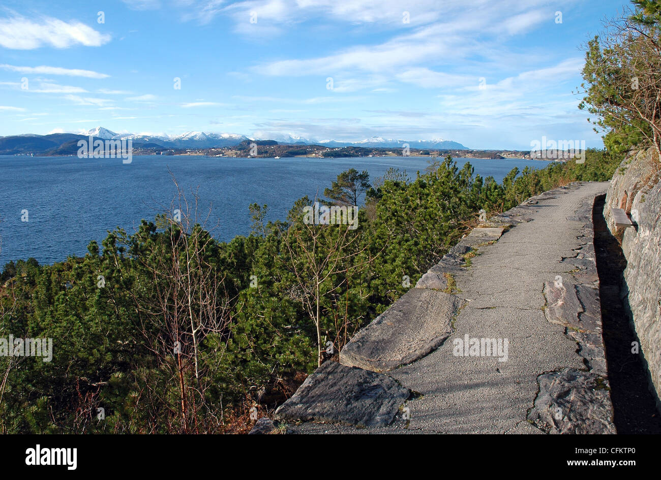 hiking footpath with view to high mountains and ocean in Kristiansund, Norway Stock Photo