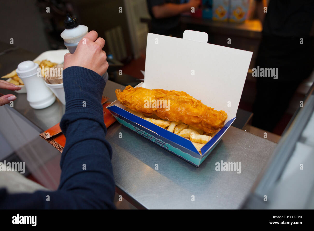 Good old fashioned fish and chips being served in a chippy in Ullapool