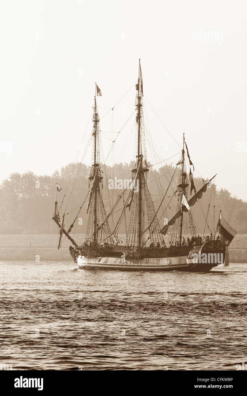 Frigate Shtandart - Russian replica of old warship - sailing on the river on a beautiful morning in fall - sepia image Stock Photo