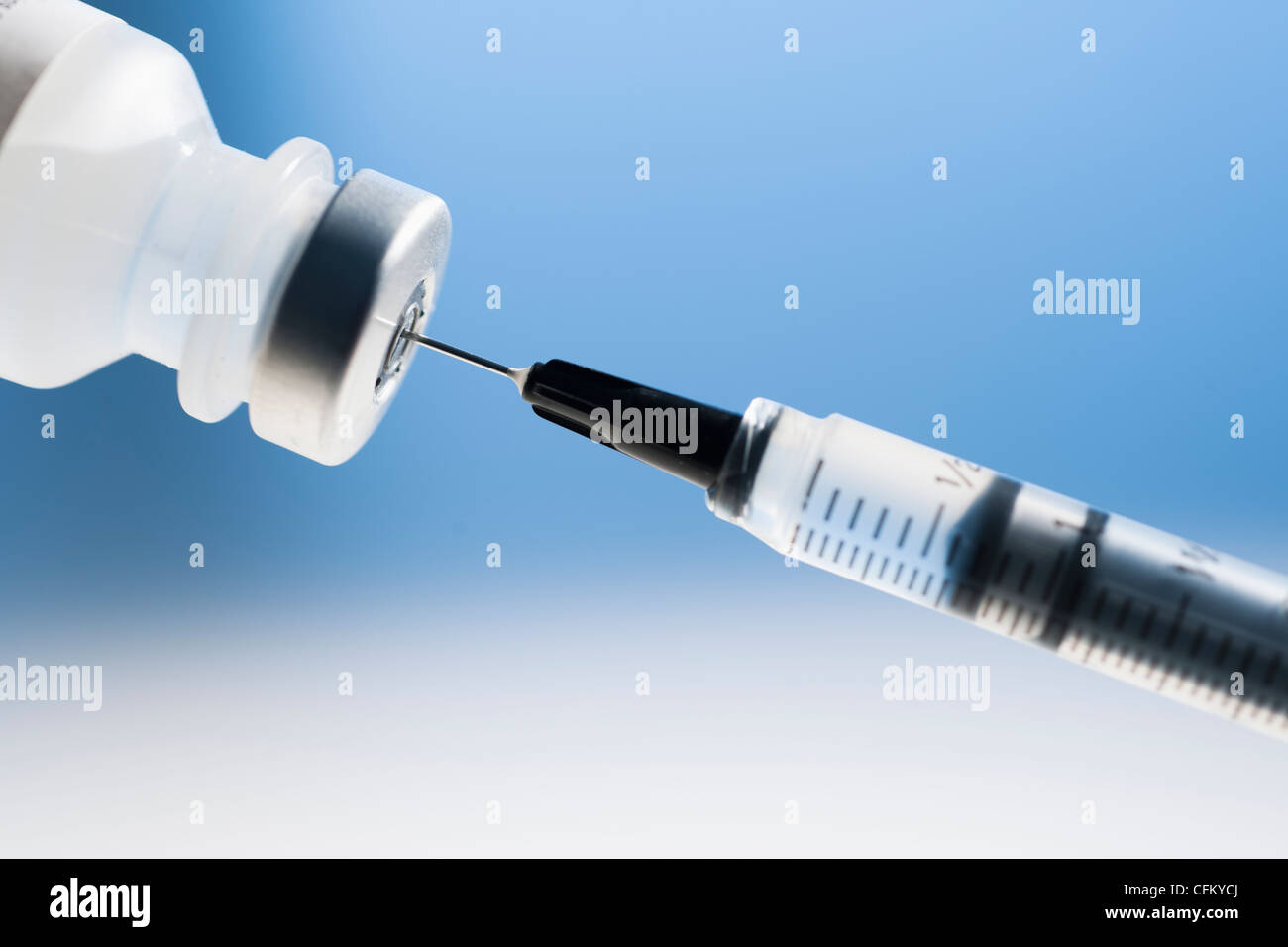 Studio shot of syringe and vial Stock Photo