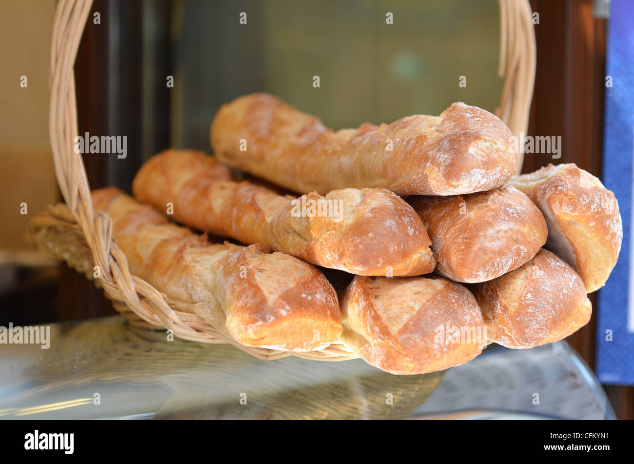 A basket of French bread baguettes for sale - shallow depth of field. Stock Photo