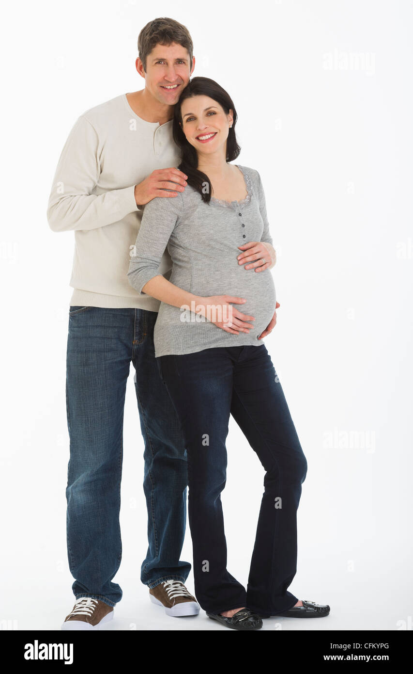 Studio portrait of man and pregnant woman Stock Photo - Alamy