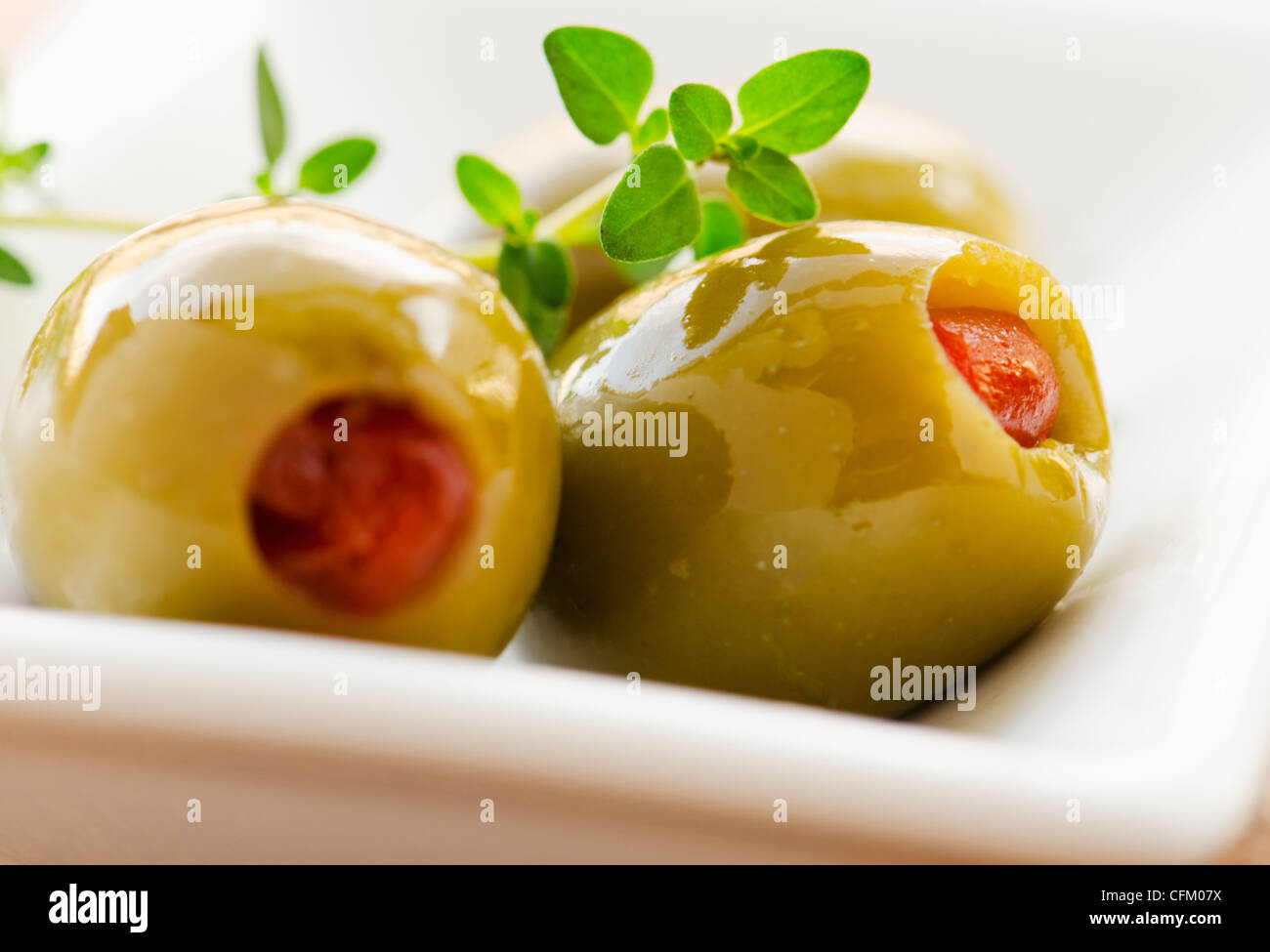 Closeup of green olives stuffed with pimento, studio shot Stock Photo