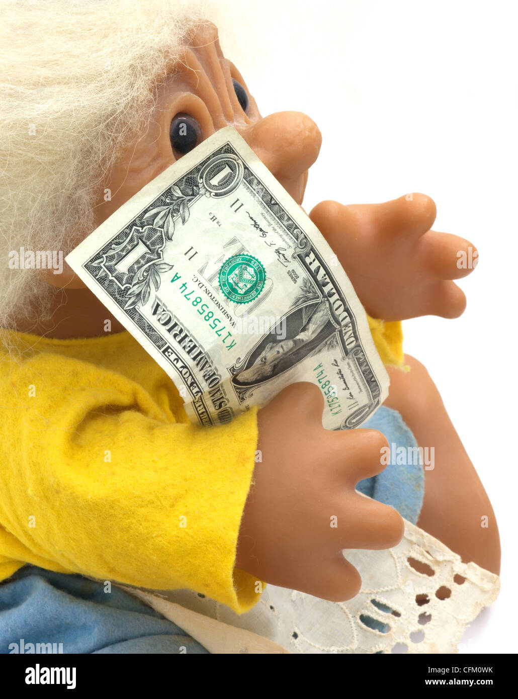 Grandma old doll person troll holding American dollar. Stock Photo