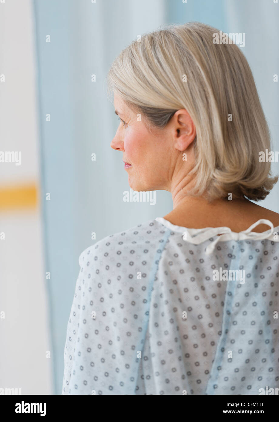 Rear view of woman in hospital gown hi-res stock photography and images ...