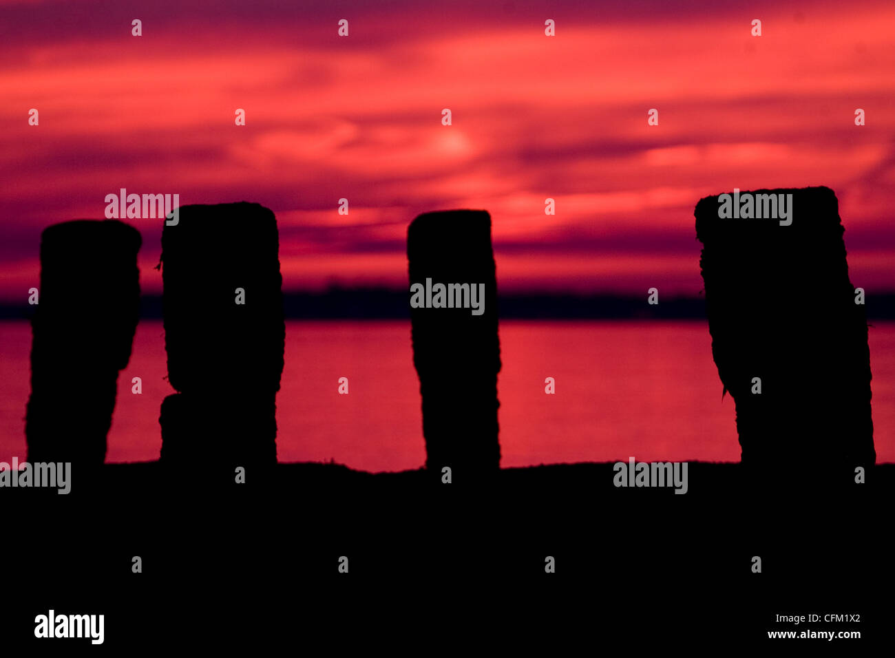 Sunset over the sea with a silhouette of a wooden pier Stock Photo - Alamy