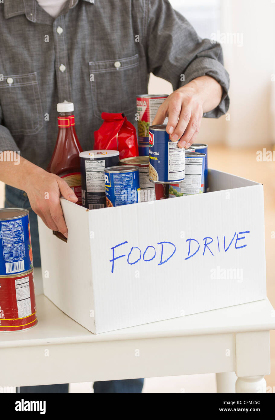Jersey City, New Jersey, Man packing food for donation Stock Photo Alamy