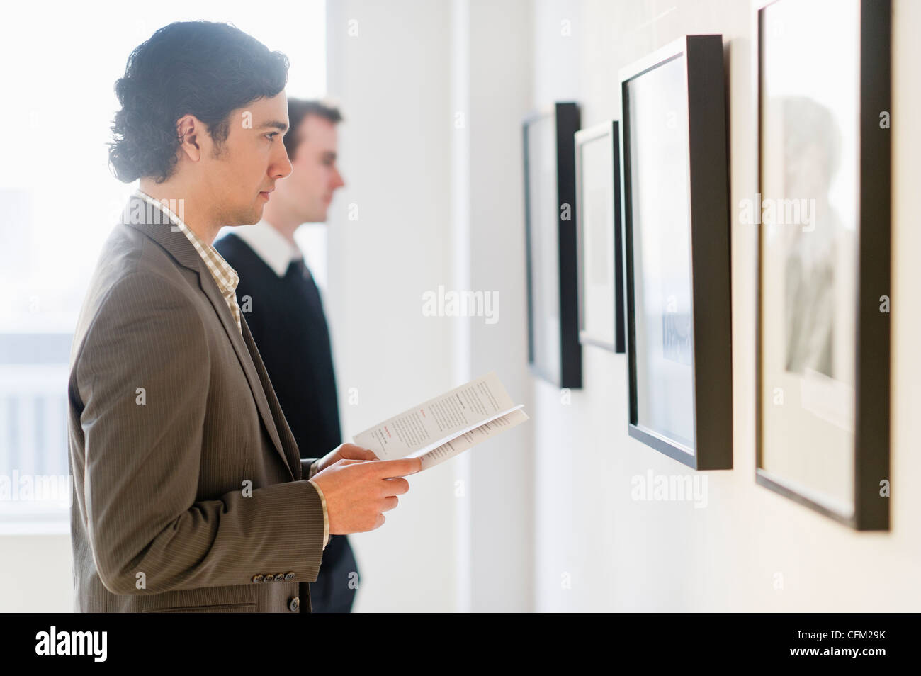 USA, New Jersey, Jersey City, Two men working in art gallery Stock Photo