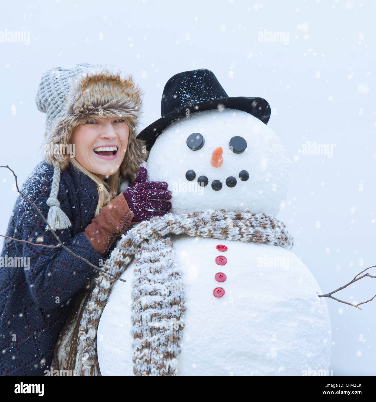 USA, New Jersey, Jersey City, Portrait of woman with snowman Stock ...