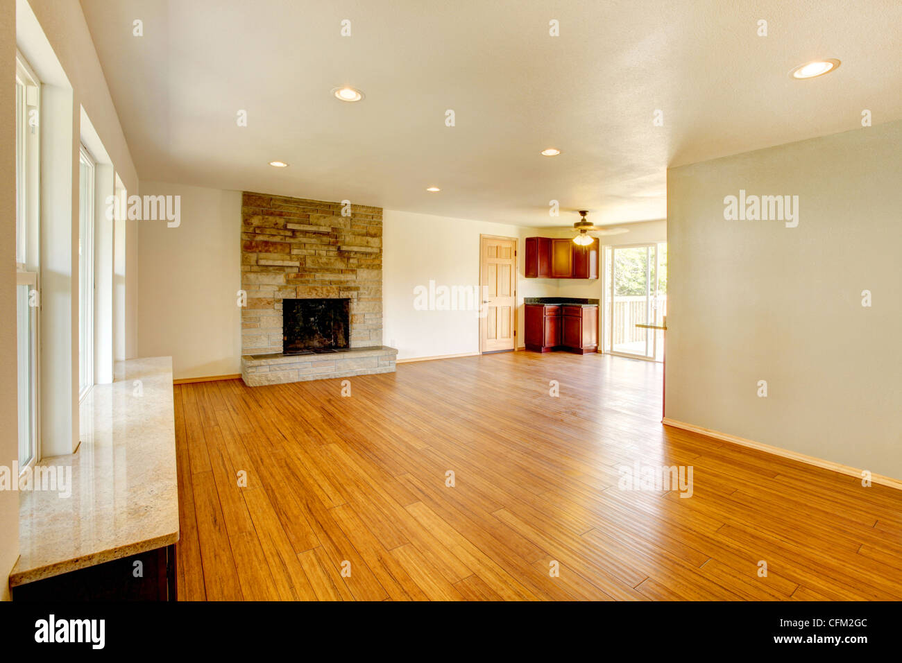 Large new empty living room with hardwood floor Stock Photo - Alamy