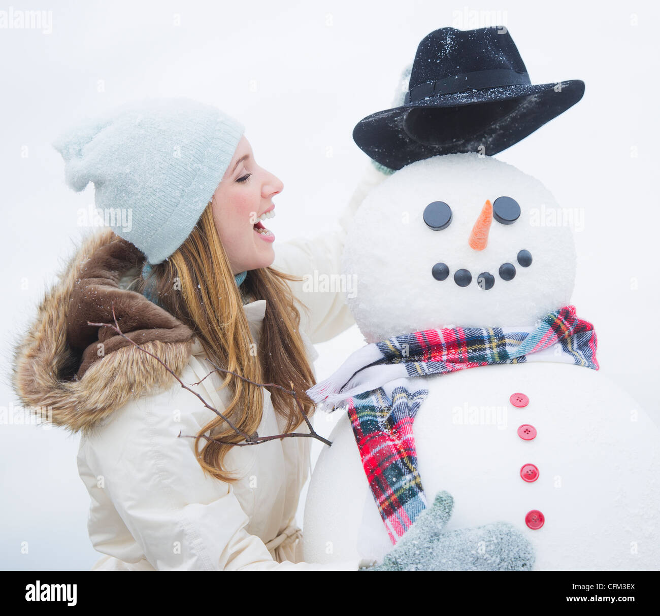 USA, New Jersey, Jersey City, profile of young woman with snowman Stock ...