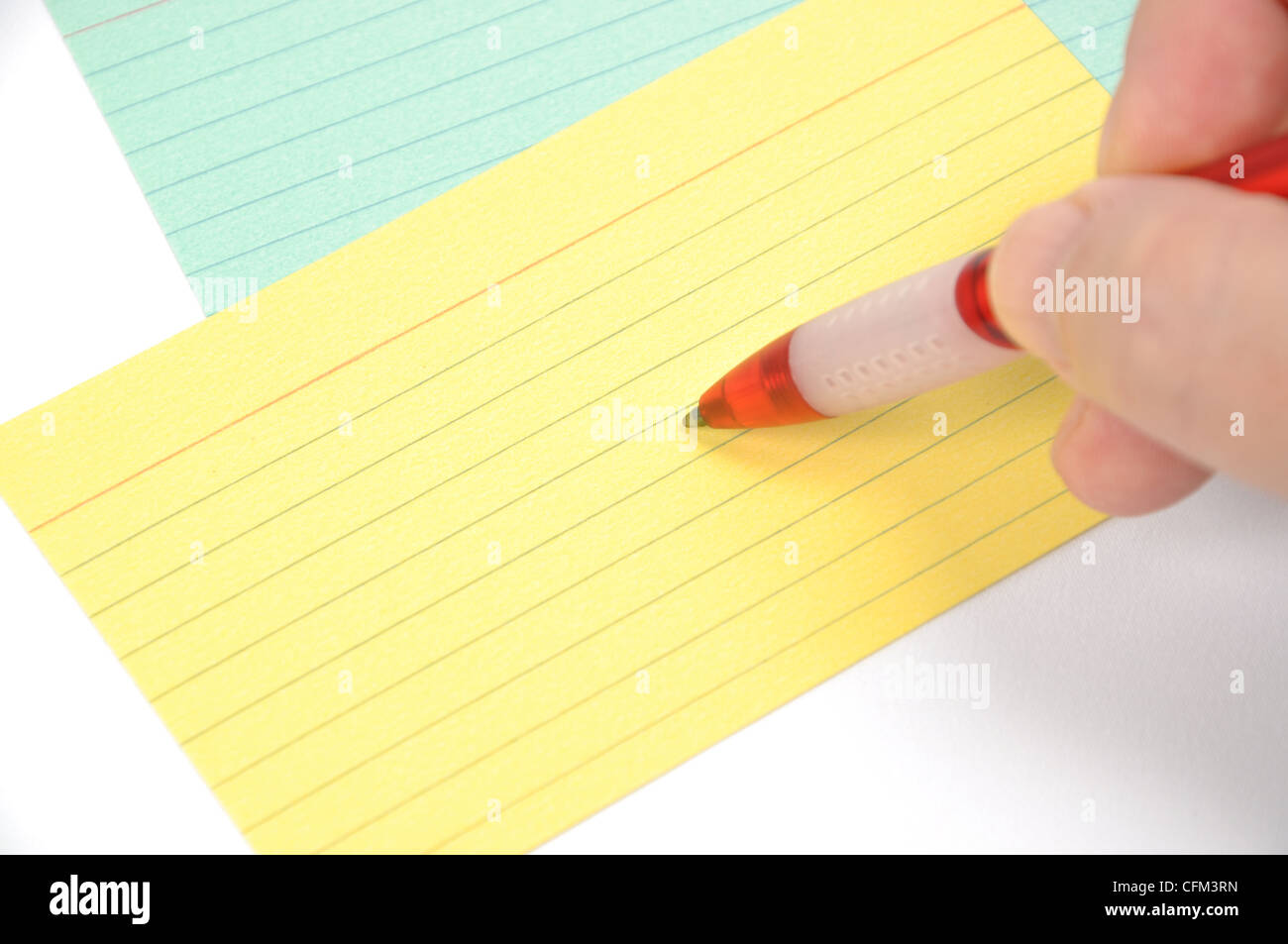Hand hold a pen writing isolated white background Stock Photo - Alamy